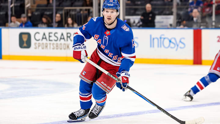 Apr 5, 2026; New York, New York, USA; New York Rangers left wing Alexis Lafreniere (13) skates against the Washington Capitals during the second period at Madison Square Garden. Mandatory Credit: Danny Wild-Imagn Images