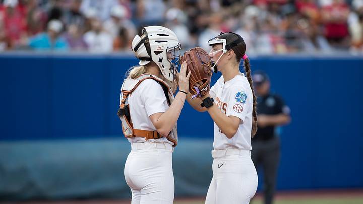 Jun 6, 2025; Oklahoma City, OK, USA;  Texas Longhorns utility Reese Atwood (14) and pitcher Teagan Kavan (17).