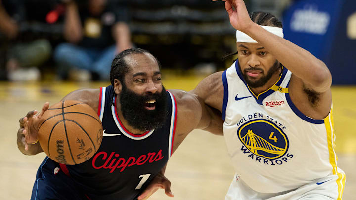 Apr 13, 2025; San Francisco, California, USA; LA Clippers guard James Harden (1) drives to the basket against Golden State Warriors guard Moses Moody (4) during the third quarter at Chase Center. Mandatory Credit: Robert Edwards-Imagn Images