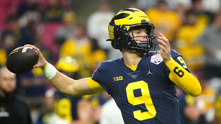 December 31, 2022; Glendale, Ariz; USA; Michigan quarterback JJ McCarthy (9) throws a pass during