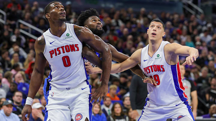 Detroit Pistons center Jalen Duren (0), forward Simone Fontecchio (19) and Orlando Magic forward Jonathan Isaac (1) look for the rebound during the second half at Kia Center.