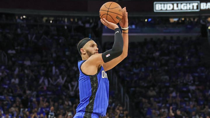 May 3, 2024; Orlando, Florida, USA; Orlando Magic guard Jalen Suggs (4) shoots a three point basket against the Cleveland Cavaliers during the second quarter of game six of the first round for the 2024 NBA playoffs at Kia Center. Mandatory Credit: Mike Watters-Imagn Images
