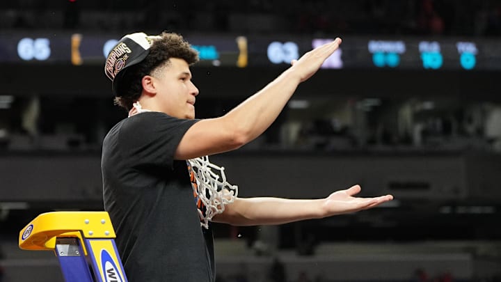Apr 7, 2025; San Antonio, TX, USA; Florida Gators guard Walter Clayton Jr. (1) reacts after cutting down a piece of the net after winning the national championship game of the Final Four of the 2025 NCAA Tournament at the Alamodome. Mandatory Credit: Bob Donnan-Imagn Images