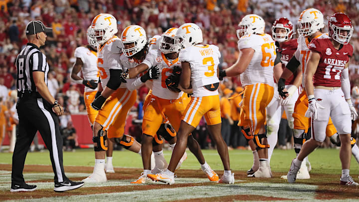 Oct 5, 2024; Fayetteville, Arkansas, USA; Tennessee Volunteers running back Dylan Sampson (6) celebrates with teammates after rushing for a touchdown in the third quarter against the Arkansas Razorbacks at Donald W. Reynolds Razorback Stadium. Arkansas won 19-14. Mandatory Credit: Nelson Chenault-Imagn Images