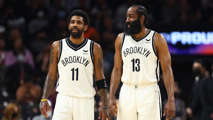 Feb 1, 2022; Phoenix, Arizona, USA; Brooklyn Nets guard Kyrie Irving (11) and guard James Harden (13) against the Phoenix Suns at Footprint Center. Mandatory Credit: Mark J. Rebilas-Imagn Images