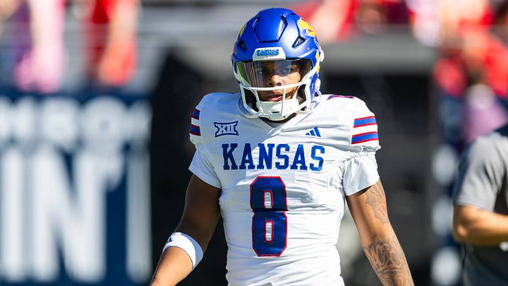 Nov 8, 2025; Tucson, Arizona, USA; Kansas Jayhawks quarterback Isaiah Marshall (8) against the Arizona Wildcats at Arizona Stadium. Mandatory Credit: Mark J. Rebilas-Imagn Images Nov 8, 2025; Tucson, Arizona, USA; Kansas Jayhawks quarterback Isaiah Marshall (8) against the Arizona Wildcats at Arizona Stadium. Mandatory Credit: Mark J. Rebilas-Imagn Images