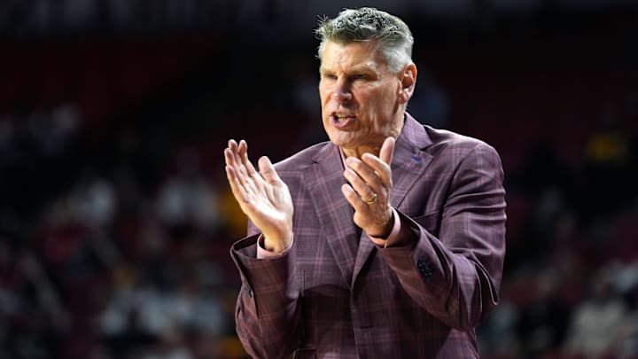 Oklahoma coach Porter Moser encourages his team as they battle Missouri at the Lloyd Noble Center.