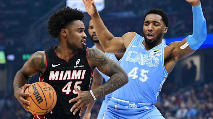 Mar 5, 2025; Cleveland, Ohio, USA; Miami Heat guard Davion Mitchell (45) drives to the basket against Cleveland Cavaliers guard Donovan Mitchell (45) during the first half at Rocket Arena. Mandatory Credit: Ken Blaze-Imagn Images Mar 5, 2025; Cleveland, Ohio, USA; Miami Heat guard Davion Mitchell (45) drives to the basket against Cleveland Cavaliers guard Donovan Mitchell (45) during the first half at Rocket Arena. Mandatory Credit: Ken Blaze-Imagn Images