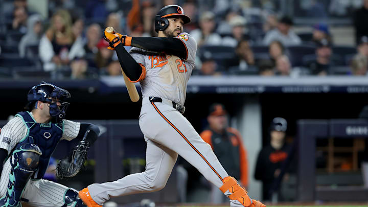 Sep 25, 2024; Bronx, New York, USA; Baltimore Orioles right fielder Anthony Santander (25) follows through on an RBI double against the New York Yankees during the fourth inning at Yankee Stadium. Mandatory Credit: Brad Penner-Imagn Images