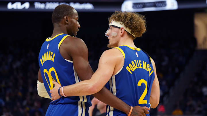 Oct 30, 2024; San Francisco, California, USA; Golden State Warriors forward Jonathan Kuminga (00) huddles with guard Brandin Podziemski (2) during the game against New Orleans Pelicans during the fourth quarter at Chase Center. Mandatory Credit: David Gonzales-Imagn Images