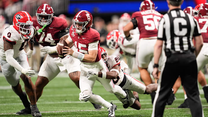 Dec 6, 2025; Atlanta, GA, USA; Alabama Crimson Tide quarterback Ty Simpson (15) is sacked by Georgia Bulldogs defensive back Jacorey Thomas (20) during the third quarter during the 2025 SEC Championship game at Mercedes-Benz Stadium. Mandatory Credit: Dale Zanine-Imagn Images