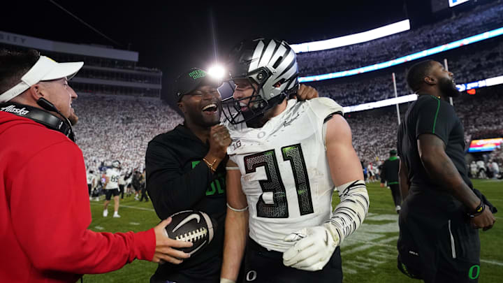 Sep 27, 2025; University Park, Pennsylvania, USA; Oregon Ducks defensive back Dillon Thieneman (31) reacts after defeating the Penn State Nittany Lions at Beaver Stadium. Mandatory Credit: James Lang-Imagn Images