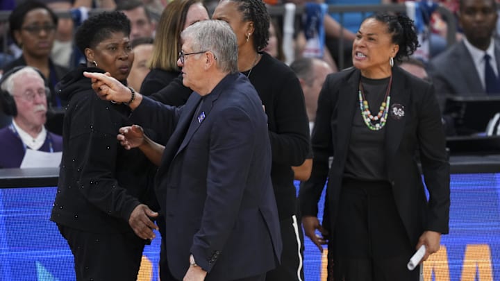 Apr 3, 2026; Phoenix, AZ, USA; UConn Huskies head coach Geno Auriemma and South Carolina Gamecocks head coach Dawn Staley argue at the end of a semifinal of the Final Four of the women's 2026 NCAA Tournament at Mortgage Matchup Center. Mandatory Credit: Joe Camporeale-Imagn Images