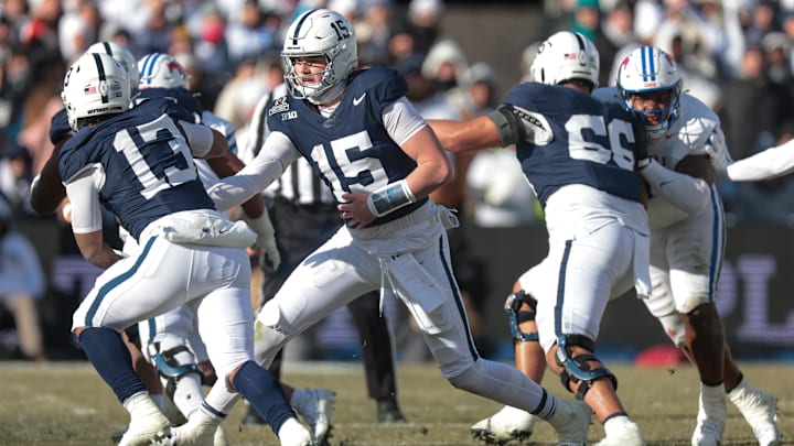 Penn State Nittany Lions quarterback Drew Allar (15) hands off to running back Kaytron Allen (13) during the first half against the SMU Mustangs at Beaver Stadium. Penn State Nittany Lions quarterback Drew Allar (15) hands off to running back Kaytron Allen (13) during the first half against the SMU Mustangs at Beaver Stadium.