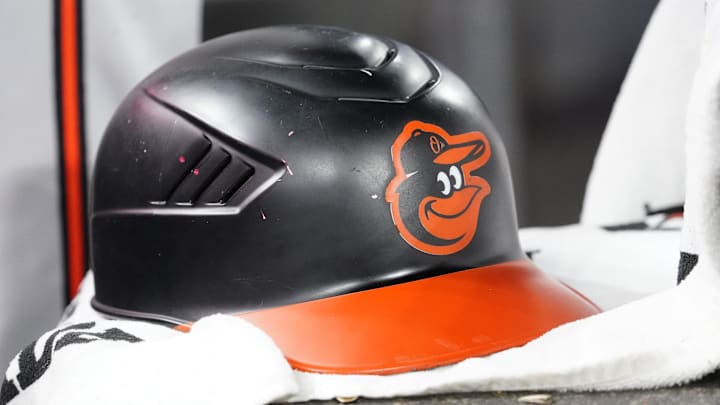 Mar 30, 2025; Toronto, Ontario, CAN; A detail view of a Baltimore Orioles batting helmet during a game against the Toronto Blue Jays at Rogers Centre. Mandatory Credit: John E. Sokolowski-Imagn Images