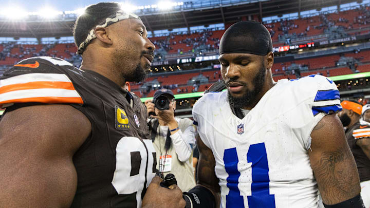 Cleveland Browns defensive end Myles Garrett congratulates Dallas Cowboys linebacker Micah Parsons after the game at Huntington Bank Field.