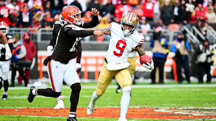 Nov 30, 2025; Cleveland, Ohio, USA;  San Francisco 49ers wide receiver Skyy Moore (9) runs the ball as Cleveland Browns tight end Blake Whiteheart (86) defends during the first half at Huntington Bank Field. Mandatory Credit: Ken Blaze-Imagn Images