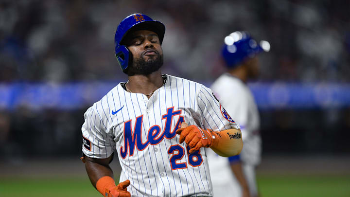 Aug 28, 2025; New York City, New York, USA; New York Mets outfielder Cedric Mullins (28) reacts after hitting a line drive for an out against the Miami Marlins during the sixth inning  at Citi Field. Mandatory Credit: John Jones-Imagn Images