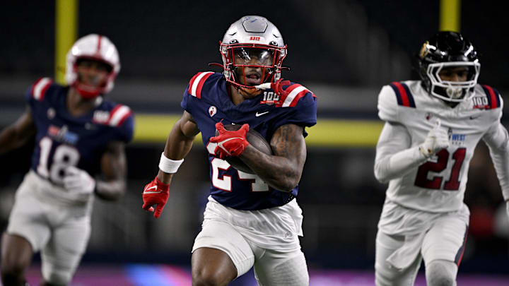 Jan 30, 2025; Arlington, TX, USA; East running back Andrew Henry of New Mexico (24) runs with ball against the West during the second half at AT&T Stadium. Mandatory Credit: Jerome Miron-Imagn Images