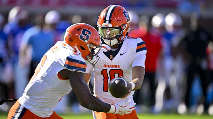 Oct 4, 2025; Dallas, Texas, USA; Syracuse Orange quarterback Rickie Collins (10) hands off the ball to running back Yasin Willis (6) during the second half against the SMU Mustangs at Gerald J. Ford Stadium. 