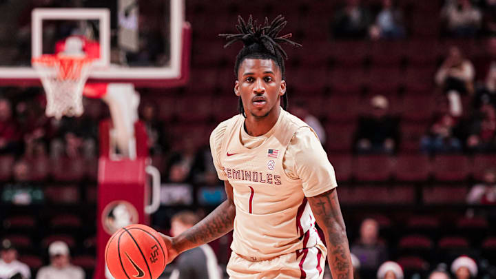 Tallahassee, Florida - Florida State Seminoles guard/forward Jamir Watkins (1) handles the ball against the Louisville Cardinals (December 21, 2024)