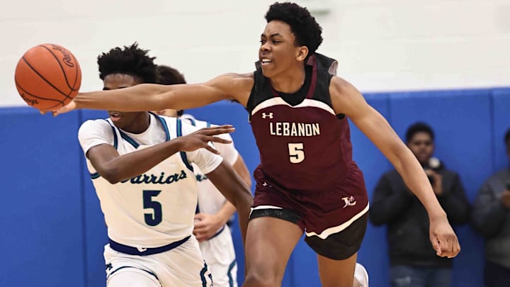 Lebanon forward Anthony Thompson (5) chases after a loose ball during their during their 50-61 loss to Winton Woods Friday, Jan. 5, 2024.