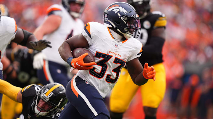 Sep 15, 2024; Denver, Colorado, USA; Denver Broncos running back Javonte Williams (33) carries the ball in the second half against the Pittsburgh Steelers at Empower Field at Mile High. Sep 15, 2024; Denver, Colorado, USA; Denver Broncos running back Javonte Williams (33) carries the ball in the second half against the Pittsburgh Steelers at Empower Field at Mile High.