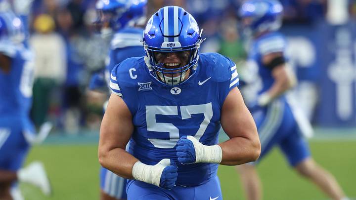 Oct 18, 2025; Provo, Utah, USA; BYU Cougars defensive tackle Keanu Tanuvasa (57) reacts to a fourth down defensive stop against the Utah Utes at LaVell Edwards Stadium. Mandatory Credit: Rob Gray-Imagn Images Oct 18, 2025; Provo, Utah, USA; BYU Cougars defensive tackle Keanu Tanuvasa (57) reacts to a fourth down defensive stop against the Utah Utes at LaVell Edwards Stadium. Mandatory Credit: Rob Gray-Imagn Images