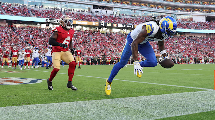 Los Angeles Rams wide receiver Davante Adams (R) and San Francisco 49ers safety Malik Mustapha (L)