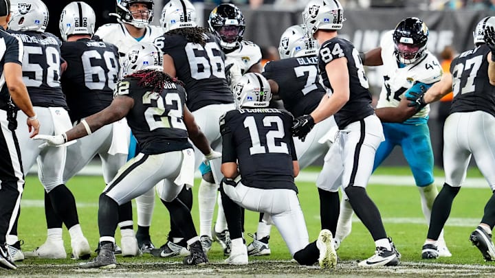 Dec 22, 2024; Paradise, Nevada, USA; Las Vegas Raiders quarterback Aidan O'Connell (12) takes a knee as the Raiders defeat the Jacksonville Jaguars 19-14 at Allegiant Stadium. Mandatory Credit: Stephen R. Sylvanie-Imagn Images Dec 22, 2024; Paradise, Nevada, USA; Las Vegas Raiders quarterback Aidan O'Connell (12) takes a knee as the Raiders defeat the Jacksonville Jaguars 19-14 at Allegiant Stadium. Mandatory Credit: Stephen R. Sylvanie-Imagn Images