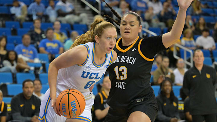 Dec 20, 2025; Los Angeles, California, USA; UCLA Bruins guard Gianna Kneepkens (8) is defended by Long Beach State Beach guard Khylee Pepe (13) during the first half at Pauley Pavilion presented by Wescom Financial. Mandatory Credit: Jayne Kamin-Oncea-Imagn Images
