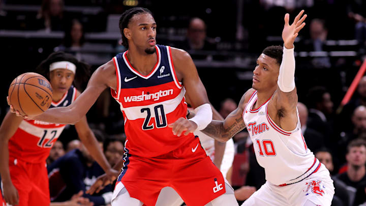 Nov 12, 2025; Houston, Texas, USA; Washington Wizards center Alex Sarr (20) handles the ball against Houston Rockets forward Jabari Smith Jr. (10) during the game at Toyota Center. Mandatory Credit: Erik Williams-Imagn Images