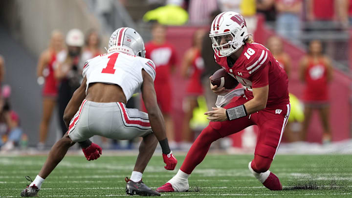 Danny O'Neil, Wisconsin Badgers, Davison Igbinosun, Ohio State Buckeyes. (Mandatory Credit: Jeff Hanisch-Imagn Images)
