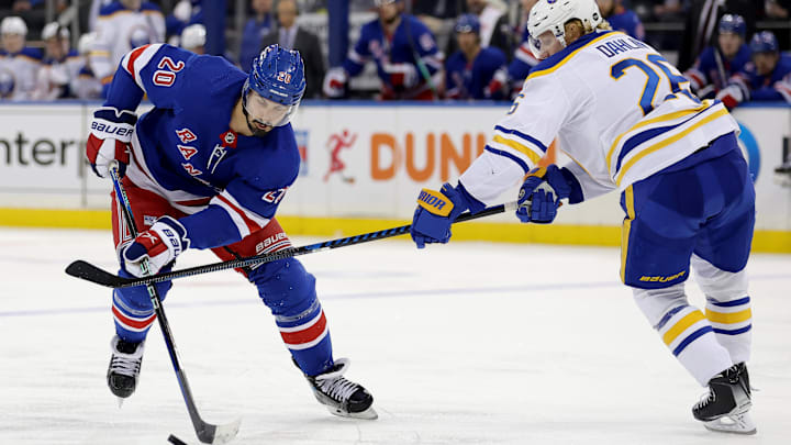 Apr 10, 2023; New York, New York, USA; New York Rangers left wing Chris Kreider (20) controls the puck against Buffalo Sabres defenseman Rasmus Dahlin (26) during the second period at Madison Square Garden. Mandatory Credit: Brad Penner-Imagn Images