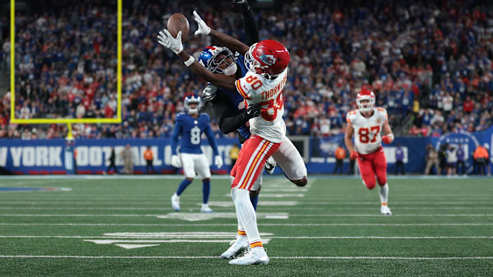 Sep 21, 2025; East Rutherford, New Jersey, USA; Kansas City Chiefs wide receiver Tyquan Thornton (80) makes a catch against New York Giants cornerback Andru Phillips (22) in the fourth quarter at MetLife Stadium. Mandatory Credit: Vincent Carchietta-Imagn Images