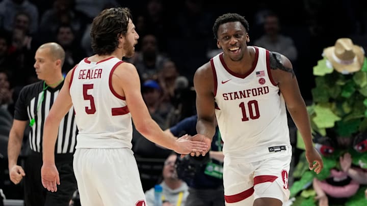 Mar 12, 2025; Charlotte, NC, USA; Stanford Cardinal forward Chisom Okpara (10) reacts with guard Benny Gealer (5) after scoring a basket and being fouled late in the second half at Spectrum Center. Mandatory Credit: Bob Donnan-Imagn Images