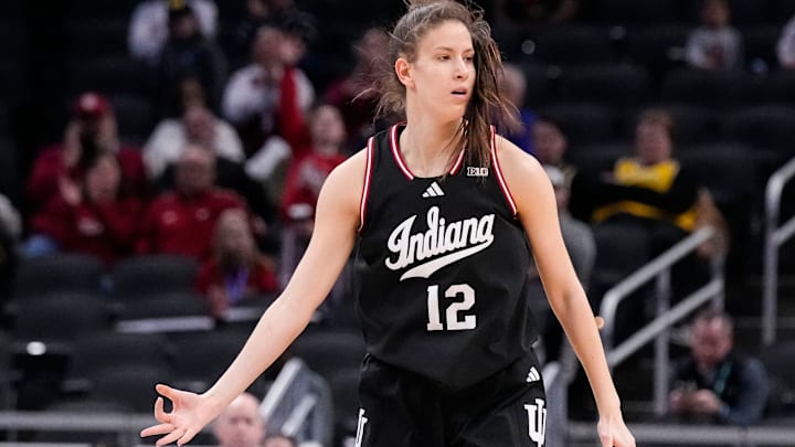 Indiana Hoosiers guard Yarden Garzon (12) celebrates scoring a three point basket Thursday, March 6, 2025, during the Big Ten women's tournament at Gainbridge Fieldhouse in Indianapolis. Indiana Hoosiers defeated the Oregon Ducks, 78-62.
