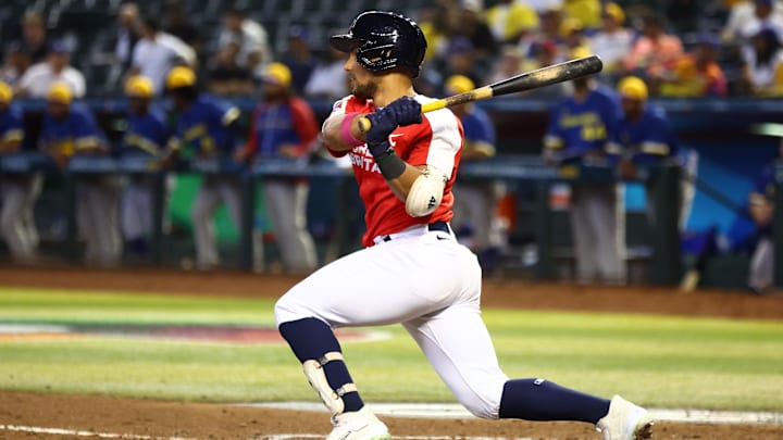 Great Britain catcher Harry Ford hits a single against Colombia during the World Baseball Classic on March 13, 2023, at Chase Field.