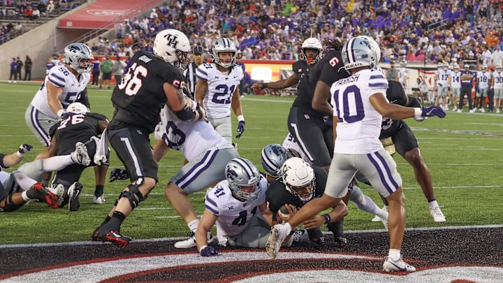 Nov 2, 2024; Houston, Texas, USA; Houston Cougars running back Donovan Smith (1) runs for a touchdown against the Kansas State Wildcats in the first quarter at TDECU Stadium. Mandatory Credit: Thomas B. Shea-Imagn Images