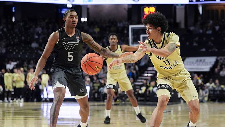 Jan 3, 2026; Winston-Salem, NC; Wake Forest forward Marqus Marion (11) is defended by Virginia Tech forward Sin'Cere Jones (5).