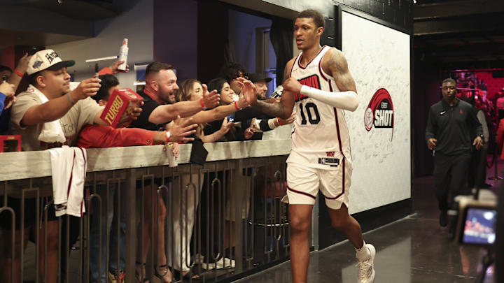 Mar 17, 2025; Houston, Texas, USA; Houston Rockets forward Jabari Smith Jr. (10) celebrates with fans after the game against the Philadelphia 76ers at Toyota Center. Mandatory Credit: Troy Taormina-Imagn Images