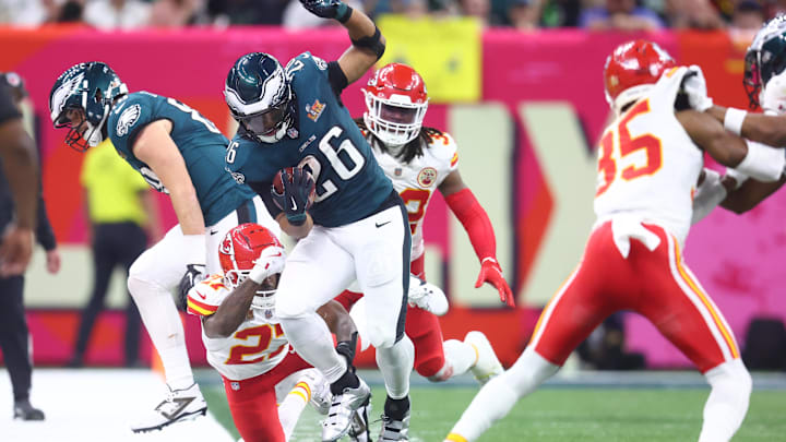 Feb 9, 2025; New Orleans, LA, USA;  Philadelphia Eagles running back Saquon Barkley (26) runs the ball against the Kansas City Chiefs in the fourth quarter in Super Bowl LIX at Ceasars Superdome. Mandatory Credit: Mark J. Rebilas-Imagn Images