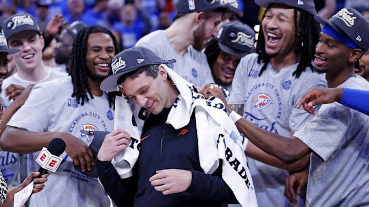May 28, 2025; Oklahoma City, Oklahoma, USA; Oklahoma City Thunder head coach Mark Daigneault celebrates with his team after defeating the Minnesota Timberwolves in game five to win the western conference finals for the 2025 NBA Playoffs at Paycom Center. Mandatory Credit: Alonzo Adams-Imagn Images