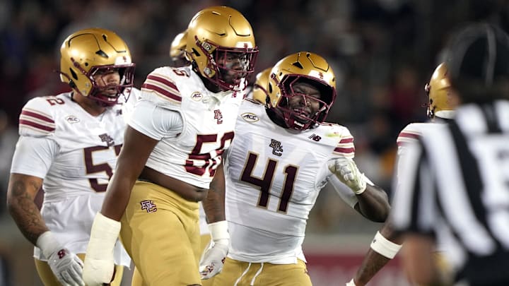 Sep 13, 2025; Stanford, California, USA; Boston College Eagles defensive lineman E'Lla Boykin (center left) and defensive lineman Favor Bate (41) celebrate during the second quarter against the Stanford Cardinal at Stanford Stadium. Mandatory Credit: Darren Yamashita-Imagn Images