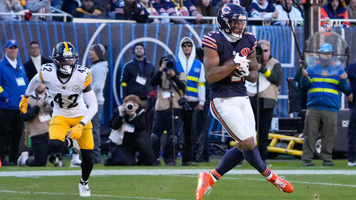 DJ Moore hauls in a touchdown pass, one of three thrown on the day by Caleb Williams.