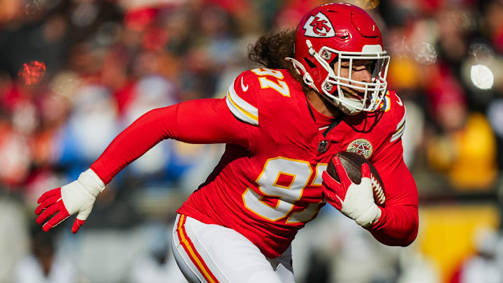 Dec 14, 2025; Kansas City, Missouri, USA; Kansas City Chiefs defensive end Ashton Gillotte (97) returns an interception during the first half against the Los Angeles Chargers at GEHA Field at Arrowhead Stadium. Mandatory Credit: Jay Biggerstaff-Imagn Images