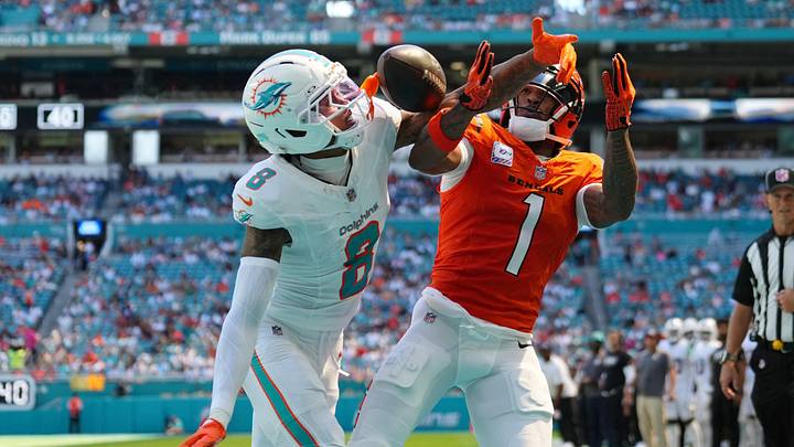 Miami Dolphins cornerback JuJu Brents (8) and Cincinnati Bengals wide receiver Ja'Marr Chase (1) battle for the ball during the first quarter at Hard Rock Stadium. Miami Dolphins cornerback JuJu Brents (8) and Cincinnati Bengals wide receiver Ja'Marr Chase (1) battle for the ball during the first quarter at Hard Rock Stadium.