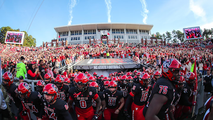 Nov 9, 2024; Raleigh, North Carolina, USA; North Carolina State Wolfpack team runs out prior to the first half of the game against Duke Blue Devils at Carter-Finley Stadium. Mandatory Credit: Jaylynn Nash-Imagn Images