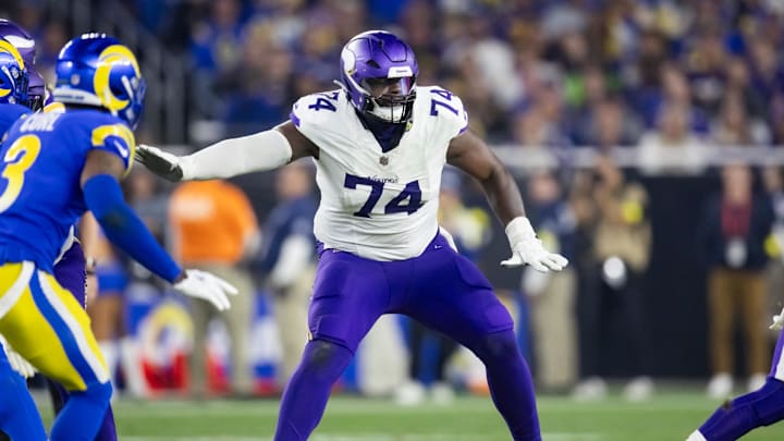 Jan 13, 2025; Glendale, AZ, USA; Minnesota Vikings tackle Cam Robinson (74) against the Los Angeles Rams during an NFC wild card game at State Farm Stadium. Mandatory Credit: Mark J. Rebilas-Imagn Images