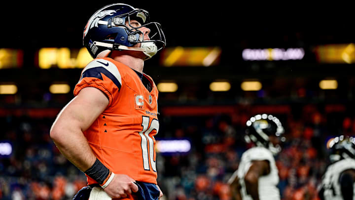 DENVER, CO - DECEMBER 21: Denver Broncos quarterback Bo Nix (10) reacts after a pressured pass resulted in an injured receiver in the fourth quarter during a game between the Jacksonville Jaguars and the Denver Broncos at Empower Field at Mile High on December 21, 2025 in Denver, Colorado. 